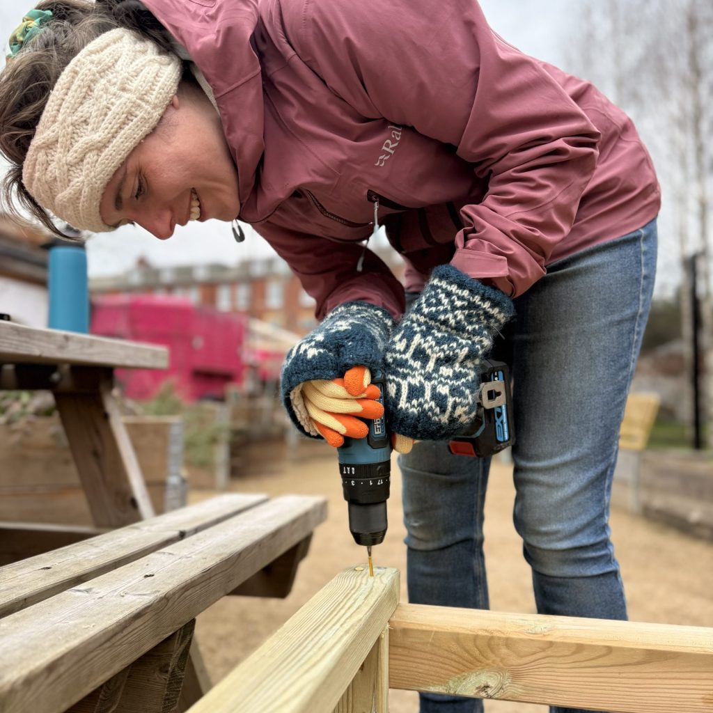 Worker building a seedling stand.